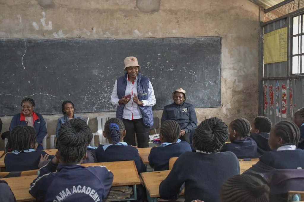 Mentor Regina Mbogo shares her journey and inspires the girls from Karama, encouraging them to believe in their potential and dream big.